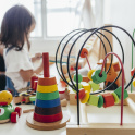 Young girl playing with educational toys at prep school