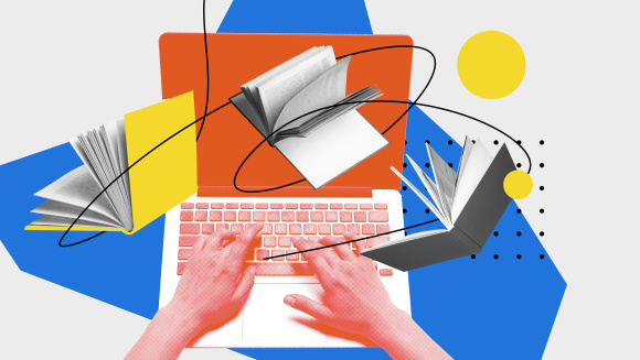 A laptop with someone typing and books flying around