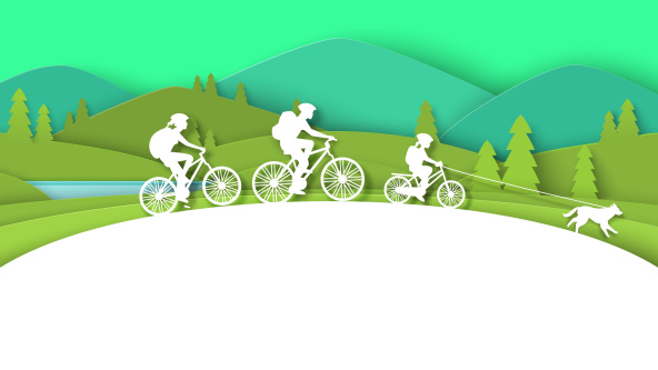 A family cycling through the countryside