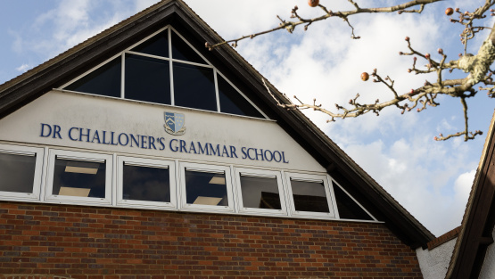 'Dr Challoner&rsquo;s Grammar School' written in large letters across the gable end of a school building