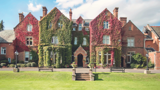 The ivy-clad main building of Queen Anne's Caversham