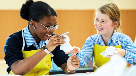 Two pupils enjoy their art lesson at Withington Girls&rsquo; School, Manchester